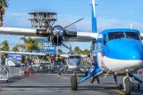Airplane in front of indoor skydiving tunnel at Skydive Perris