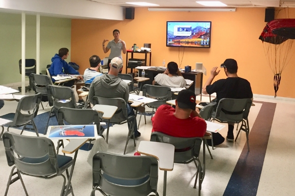 Angie Aragon teaches classroom of students about skydiving