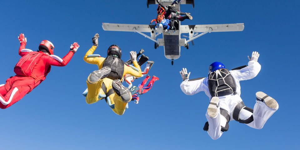 Exit shot of several jumpers leaving a Shorts Skyvan at 12,500'